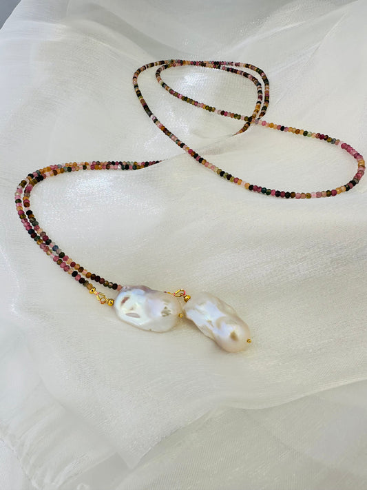 Detailed view of Multi Tourmaline Baroque Pearl Lariat Necklace on white surface — colorful tourmaline and white pearls by Loulia Pearl Jewelry