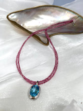 Cargar imagen en el visor de la galería, Pink Tourmaline Blue Topaz Pendant on double-strand necklace, showcasing vibrant pink and blue gemstones.