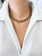 Lade das Bild in den Galerie-Viewer, Green orange garnet necklace showcased on a mannequin with multi-strand gold vermeil design.