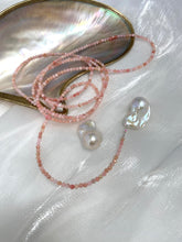 Charger l'image dans la galerie, Pink Opal Baroque Pearl Necklace featuring pink opal beads and large baroque pearls against a pearl shell background