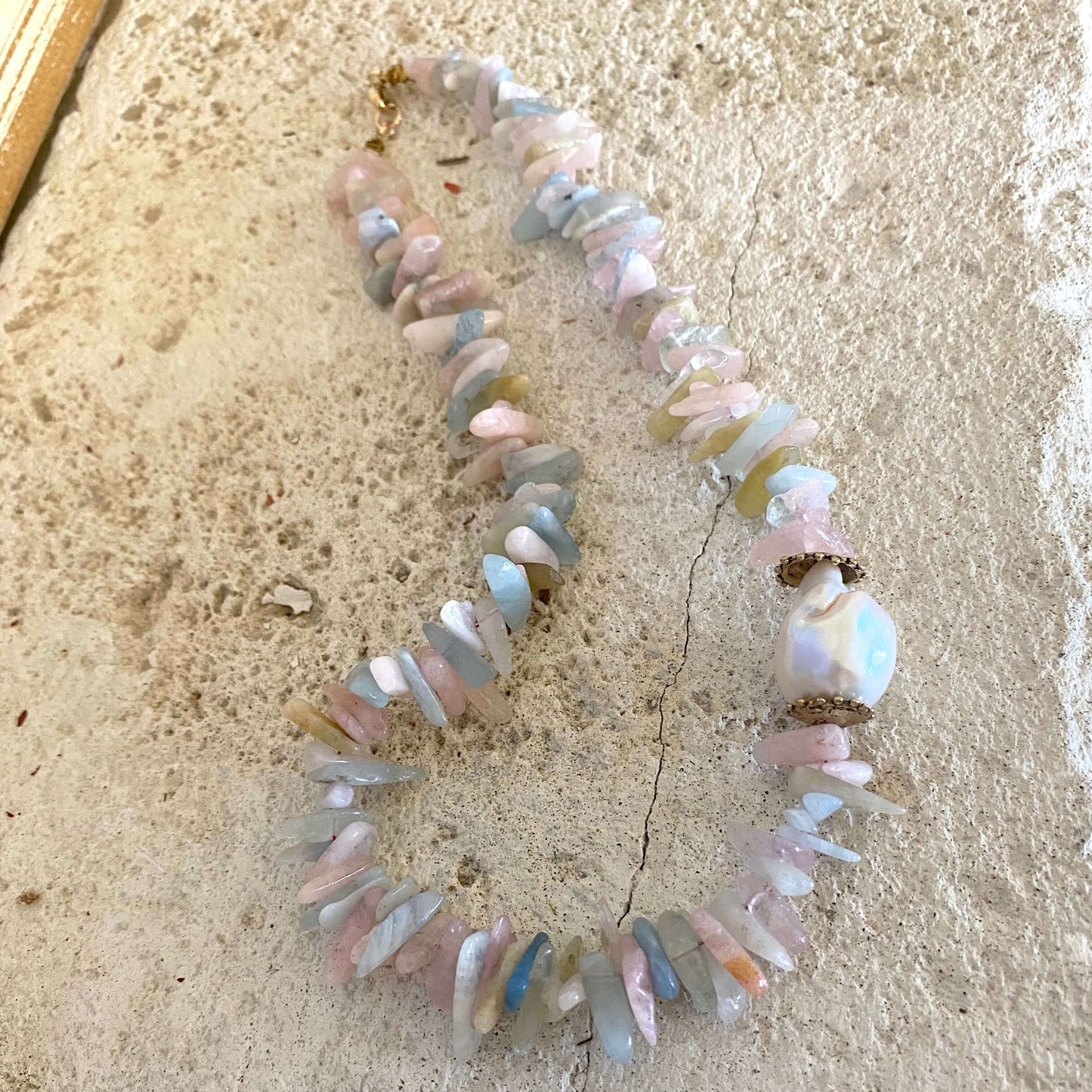 Morganite aquamarine necklace with baroque pearl, showcasing pastel gemstones and artisanal details.