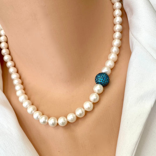 Pearl necklace with turquoise CZ bead, handmade in Canada, showcasing classic elegance and modern color.