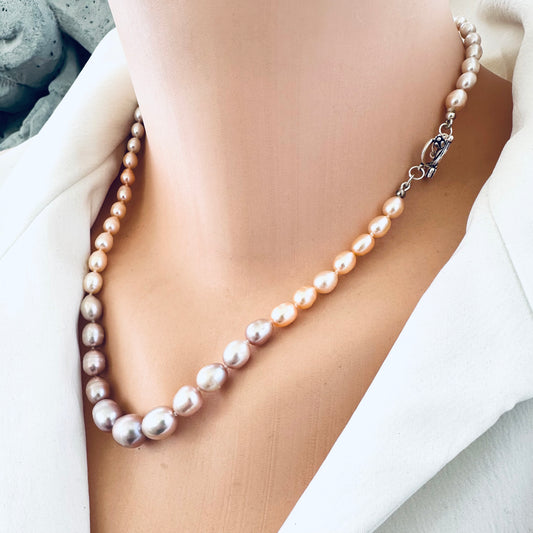 Pastel Rice Pearl Necklace featuring sterling silver tulip clasp shown in close-up on mannequin.