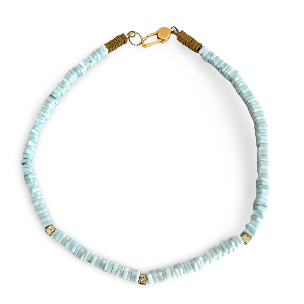 A beaded necklace made of light blue cylindrical beads with small gold spacer accents and gold-toned wrap details at the clasp, shown on a plain white background.