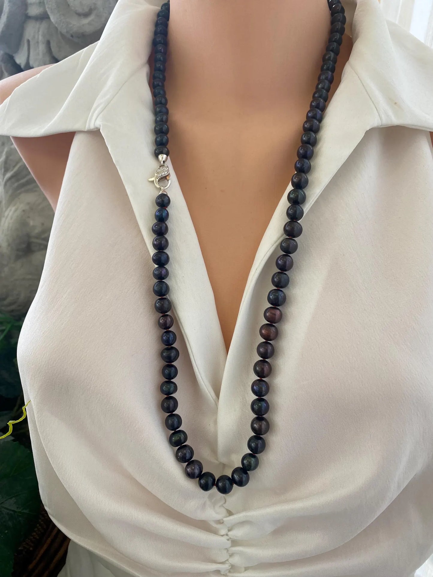 Peacock navy blue pearl necklace long worn on mannequin side view handmade in Canada