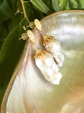 Cargar imagen en el visor de la galería, Detailed view of Baroque Pearl Gold Vermeil Earrings surrounded by pearls and green leaves — timeless handcrafted jewelry by Loulia Pearl Jewelry