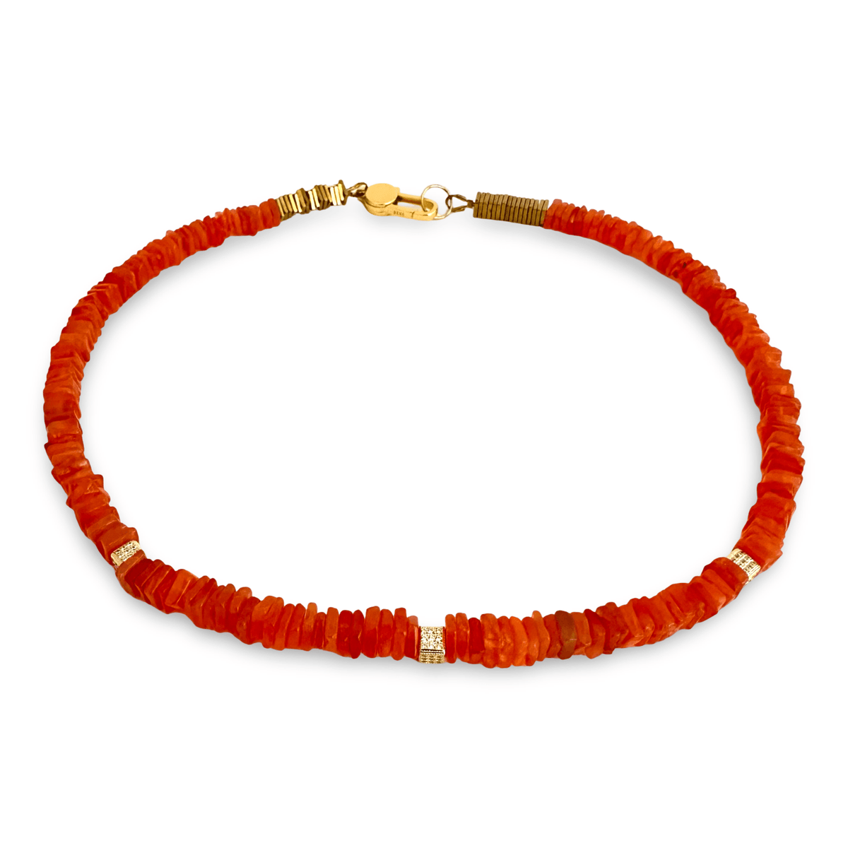 A beaded necklace made of small, faceted orange-red stone beads with gold-toned spacer details and a gold clasp, shown on a plain white background.