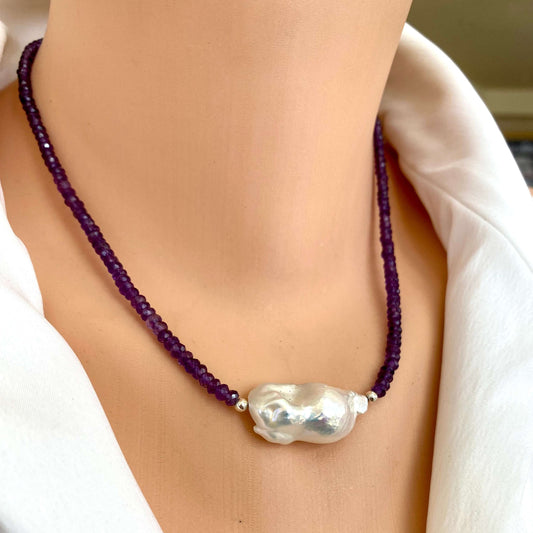 Amethyst baroque pearl necklace worn on neckline with large white baroque pearl centerpiece