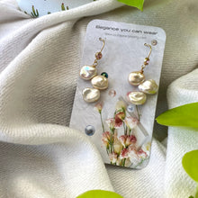Cargar imagen en el visor de la galería, Elegant earrings composed of Natural Keshi pink and white pearls hanging from gold filled hooks with pink cubic zirconia bezel
