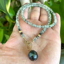 Charger l'image dans la galerie, This necklace features a delicate chain of soft, translucent faceted green Prehnite rondelle beads, beautifully complemented by a striking Tahitian baroque pearl as the centerpiece pending from a cold filled toggle clasp. 18"inches long