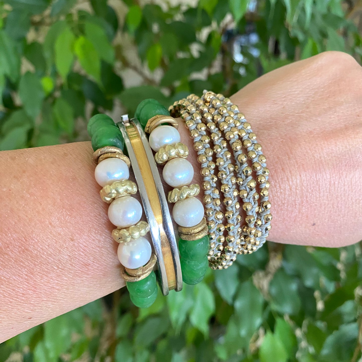 Pearl glass bracelet with green African recycled beads and contrasting gold accents.