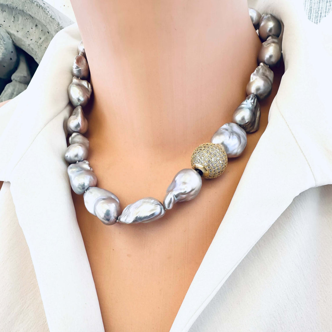 Grey baroque pearl necklace with large organic pearls worn on model