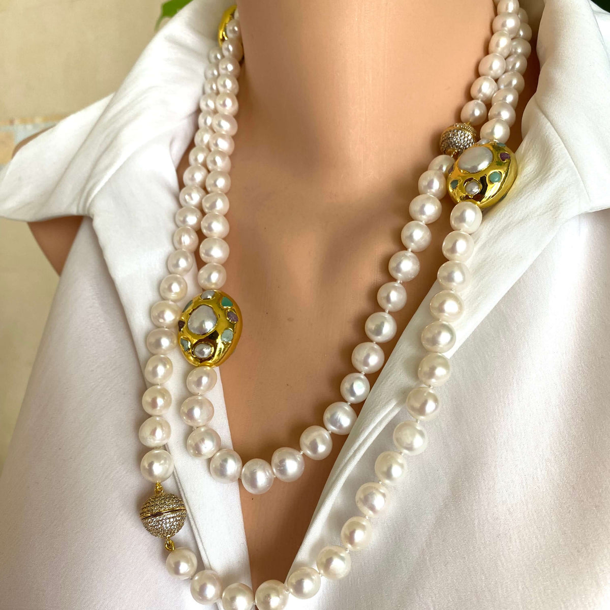 White pearl necklace with gold accent worn on a mannequin, showcasing elegant freshwater pearls and gold focal accents.