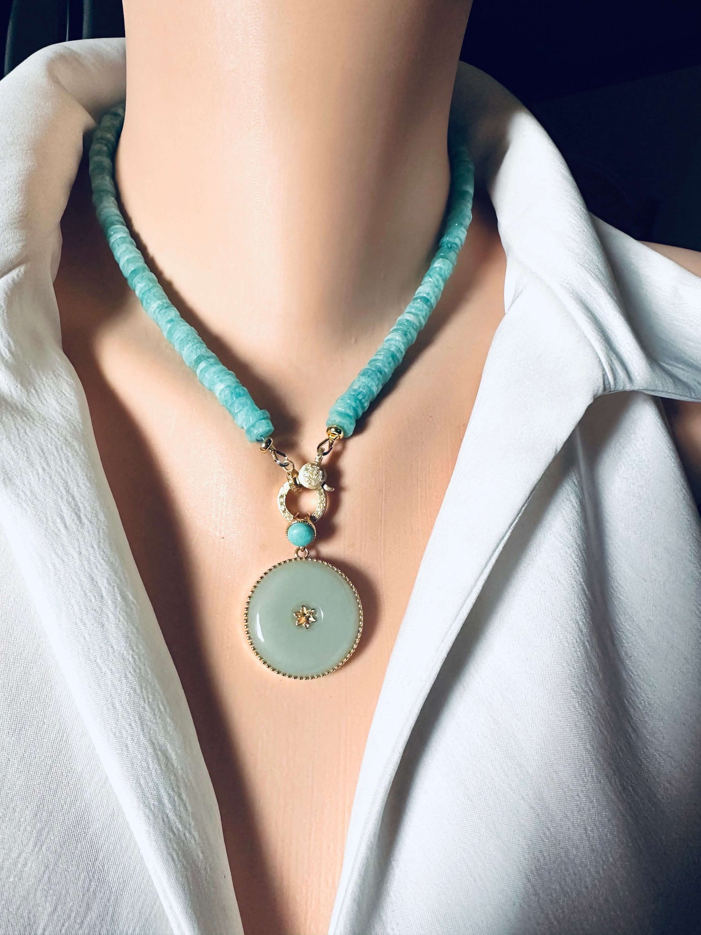 Hotan jade pendant with turquoise accent in gold vermeil on a stylish necklace.