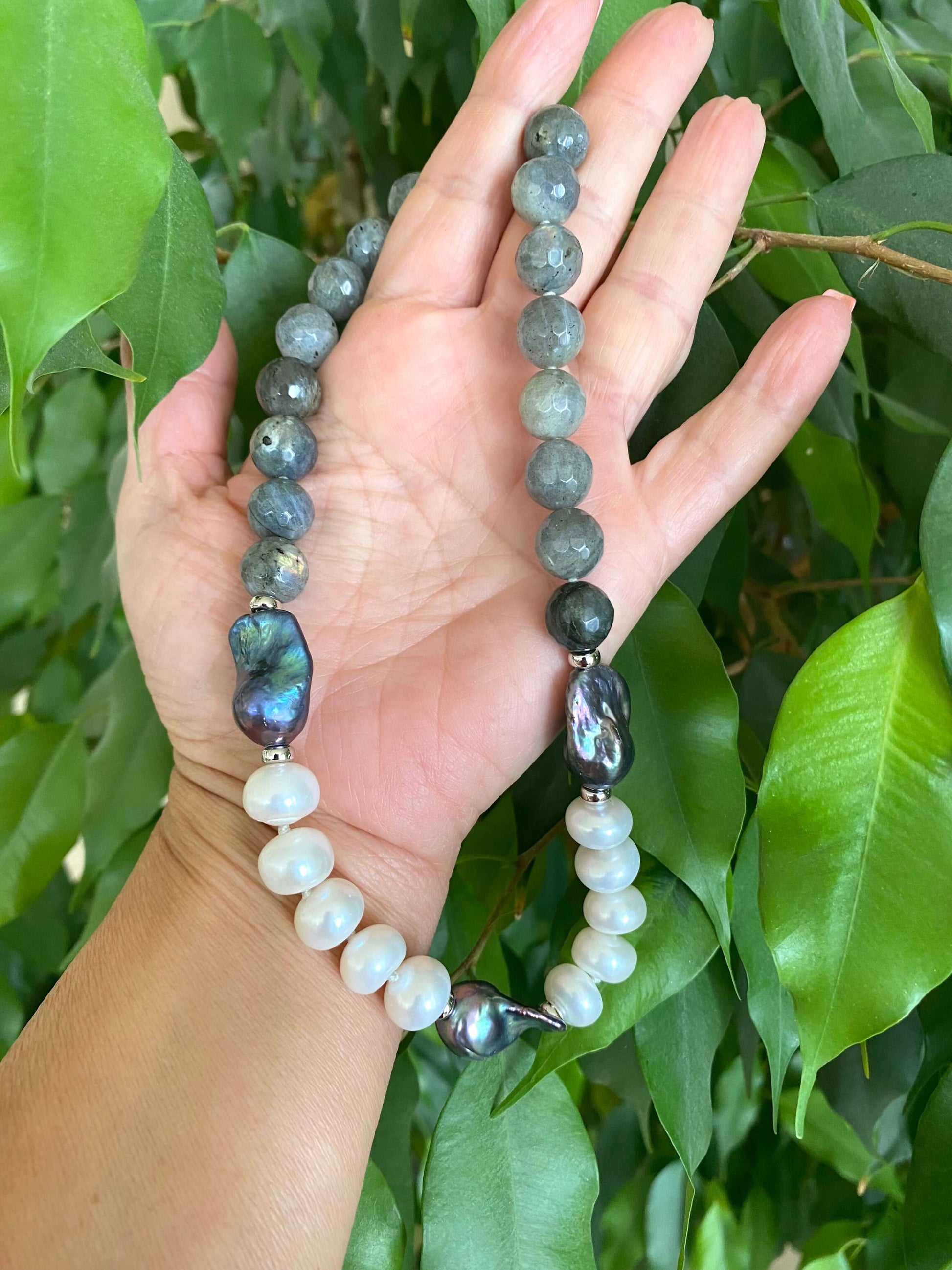 Labradorite pearl necklace featuring baroque and coin pearls, showcasing a blend of blue and green hues.
