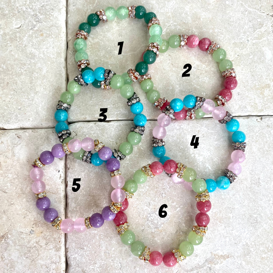 Colorful jade rhinestone stretchy bracelet variations displayed together for selection