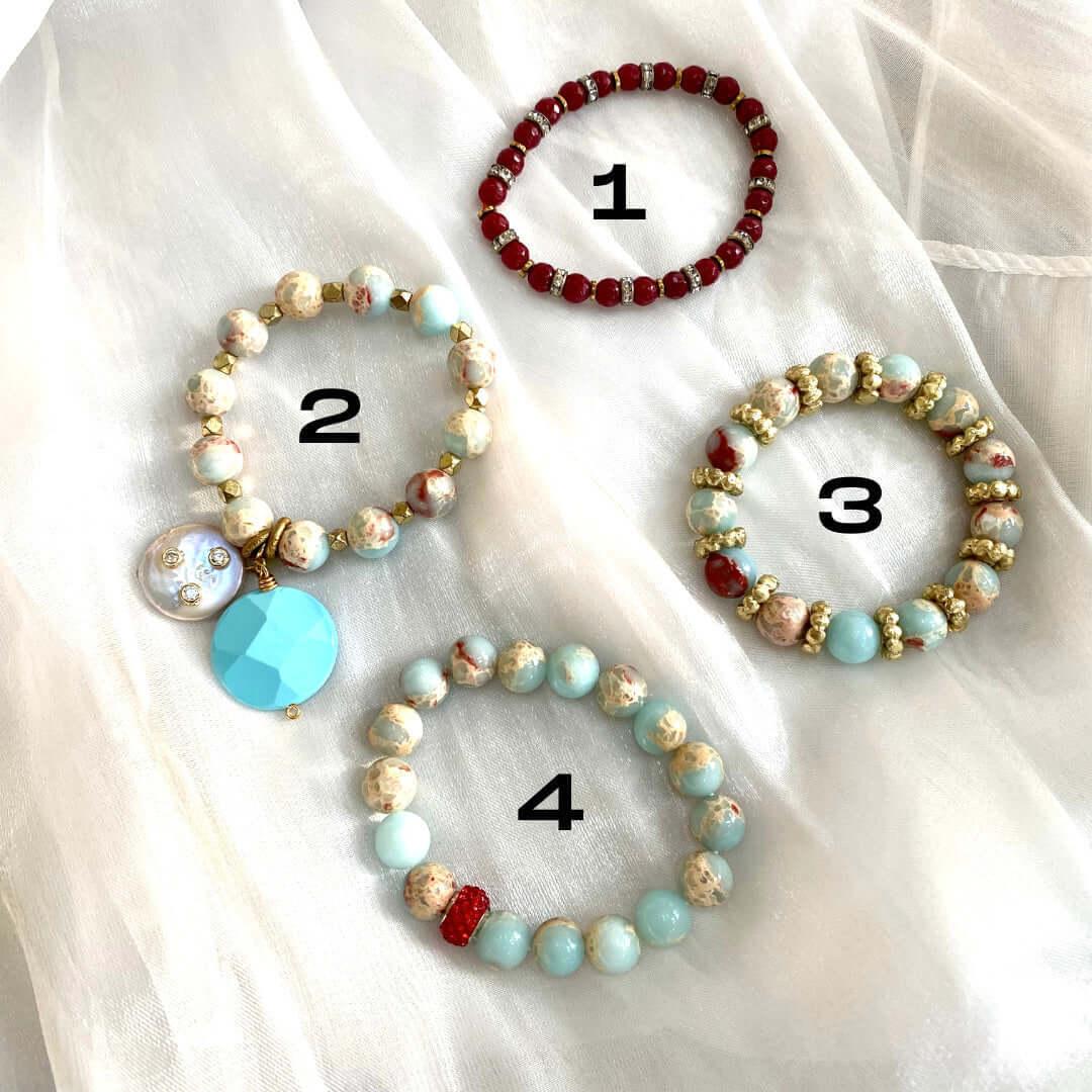 Pale blue deep red stretchy bracelet variations displayed flat with numbered style options