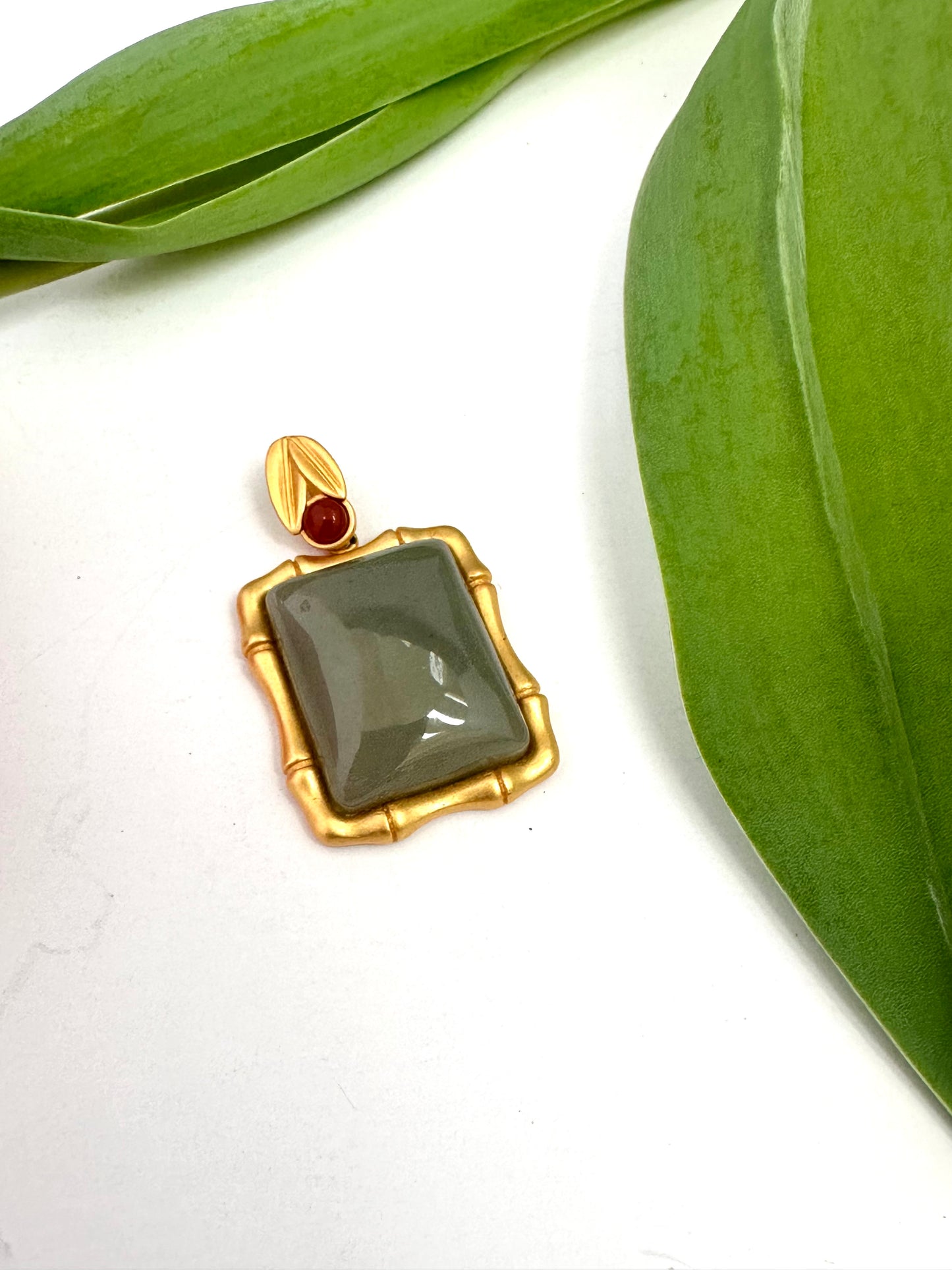 Dark green jade bamboo-style pendant with red agate accent in gold vermeil
