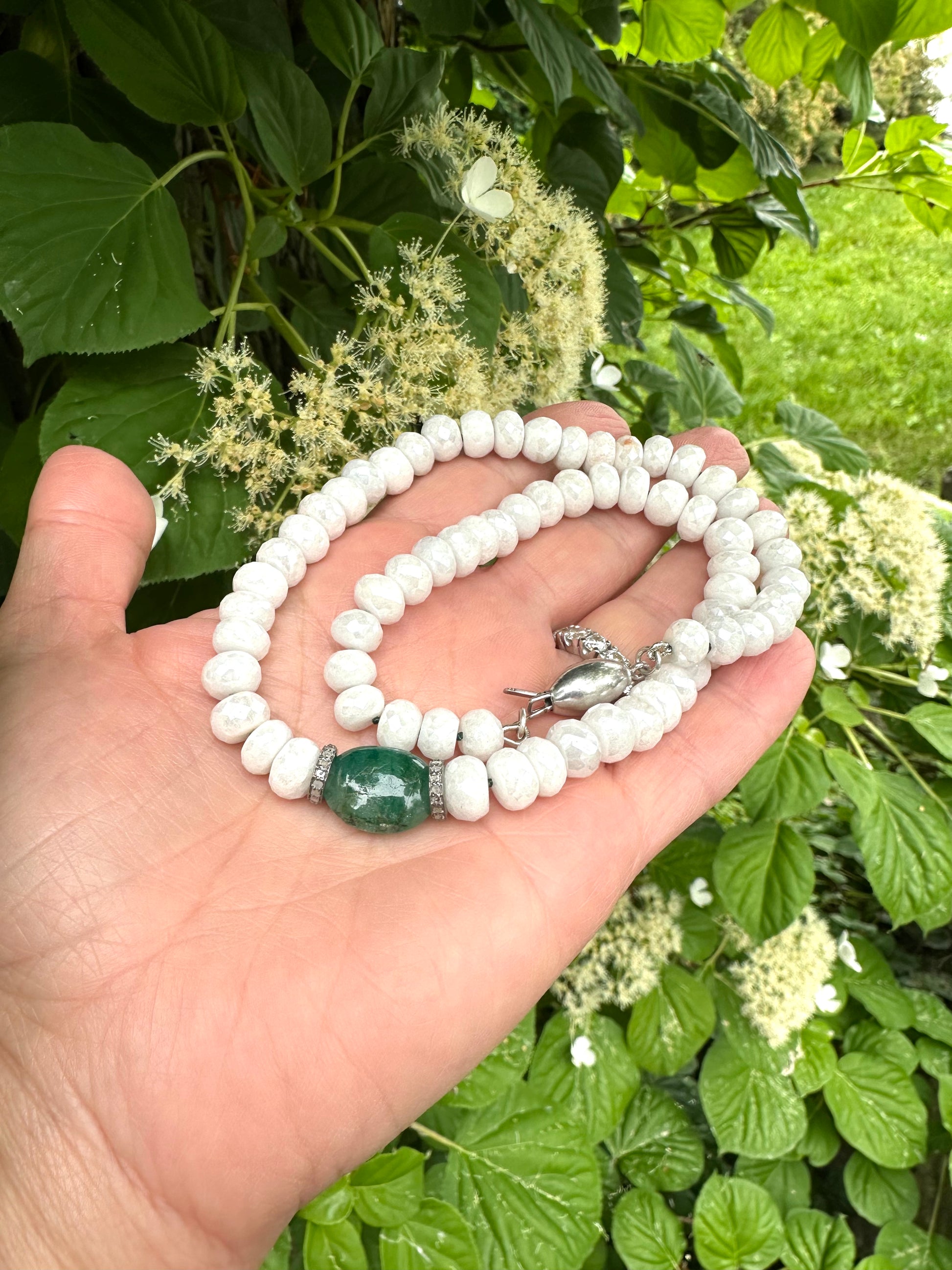 Emerald diamond choker necklace featuring white silverite beads emerald centerpiece and diamonds