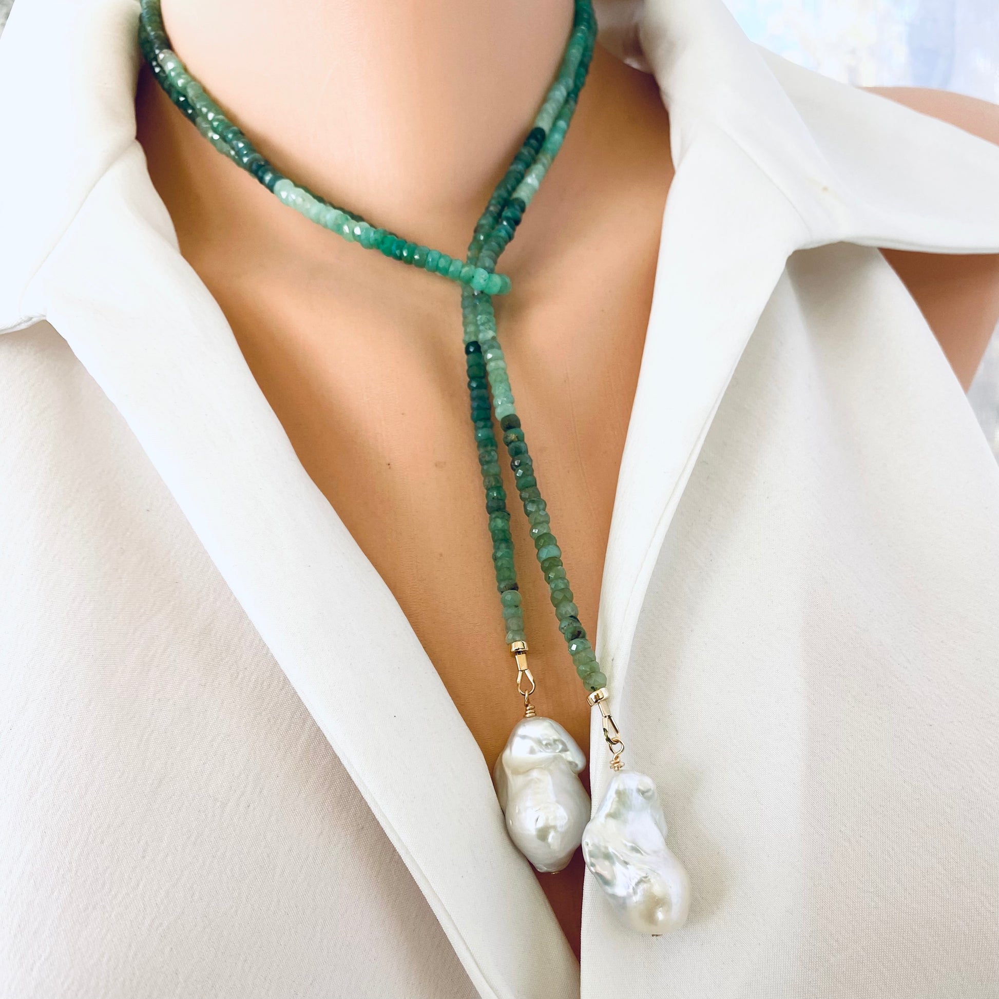 Chrysoprase lariat necklace with baroque pearls worn on neckline