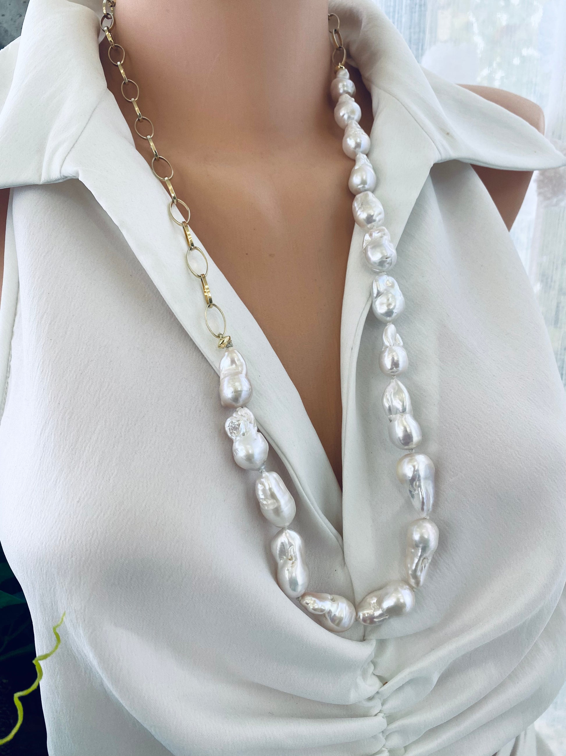 Side view of baroque pearl gold chain necklace on mannequin — elegant handcrafted pearl and gold necklace design by Loulia Pearl Jewelry