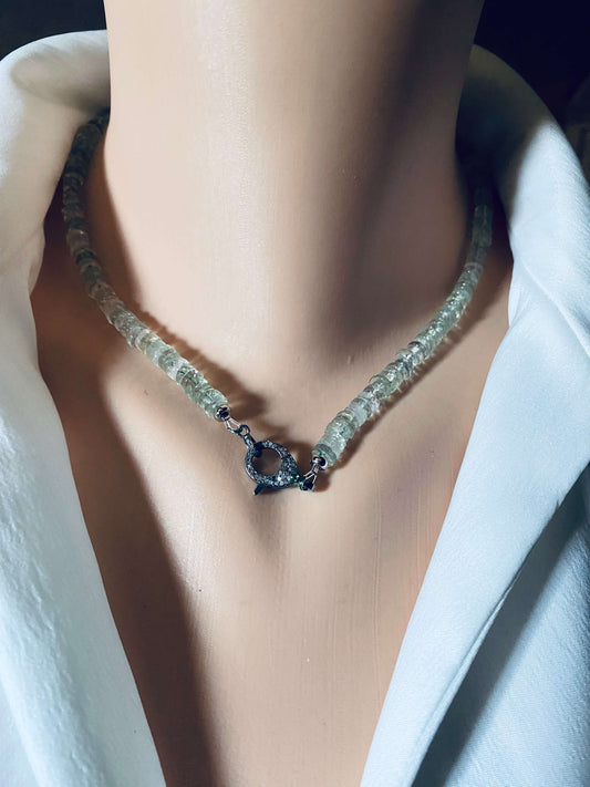 Green amethyst beaded necklace with diamond and emerald pavé clasp displayed on a mannequin.