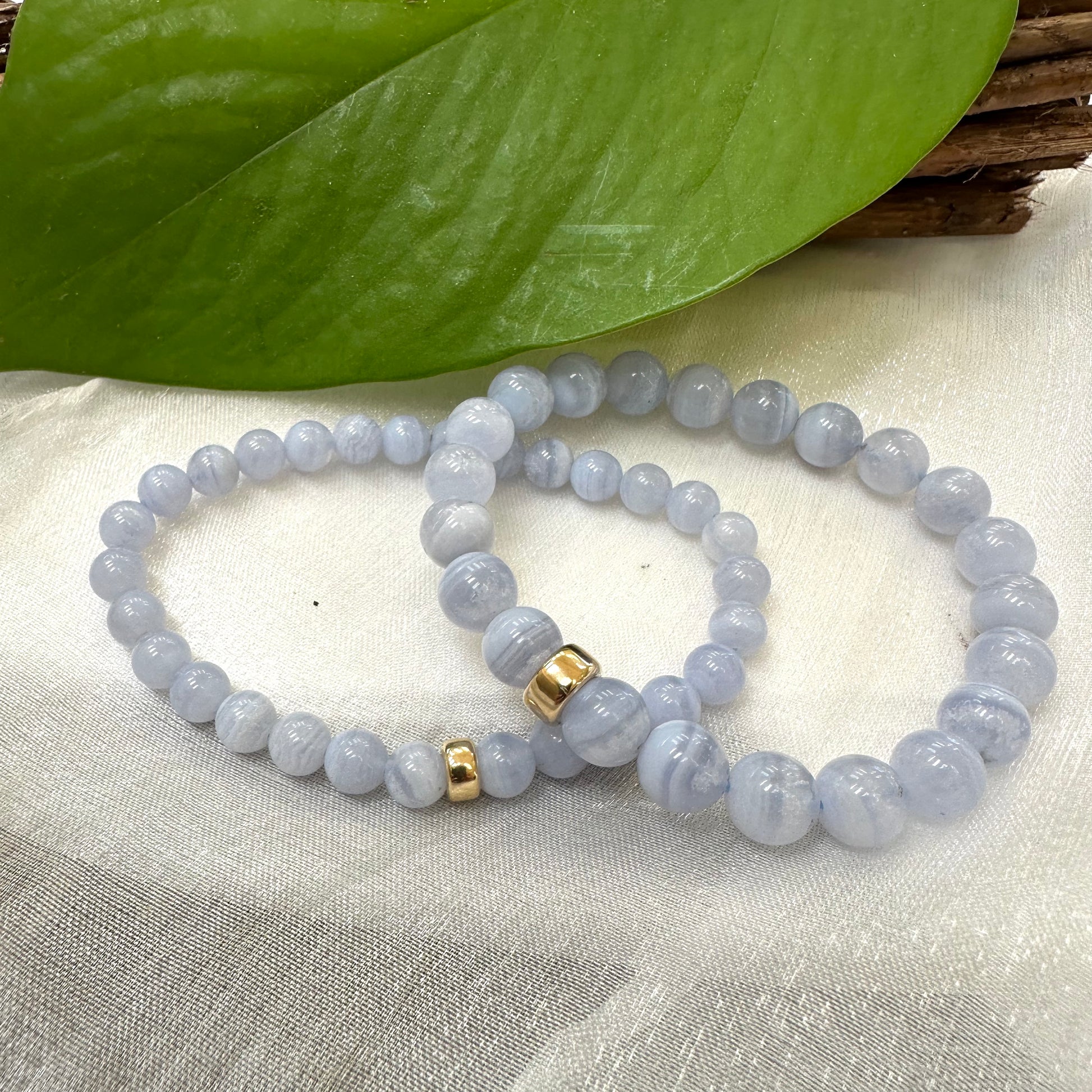 Blue Lace Agate Bracelet pair on white cloth – two-bracelet product shot