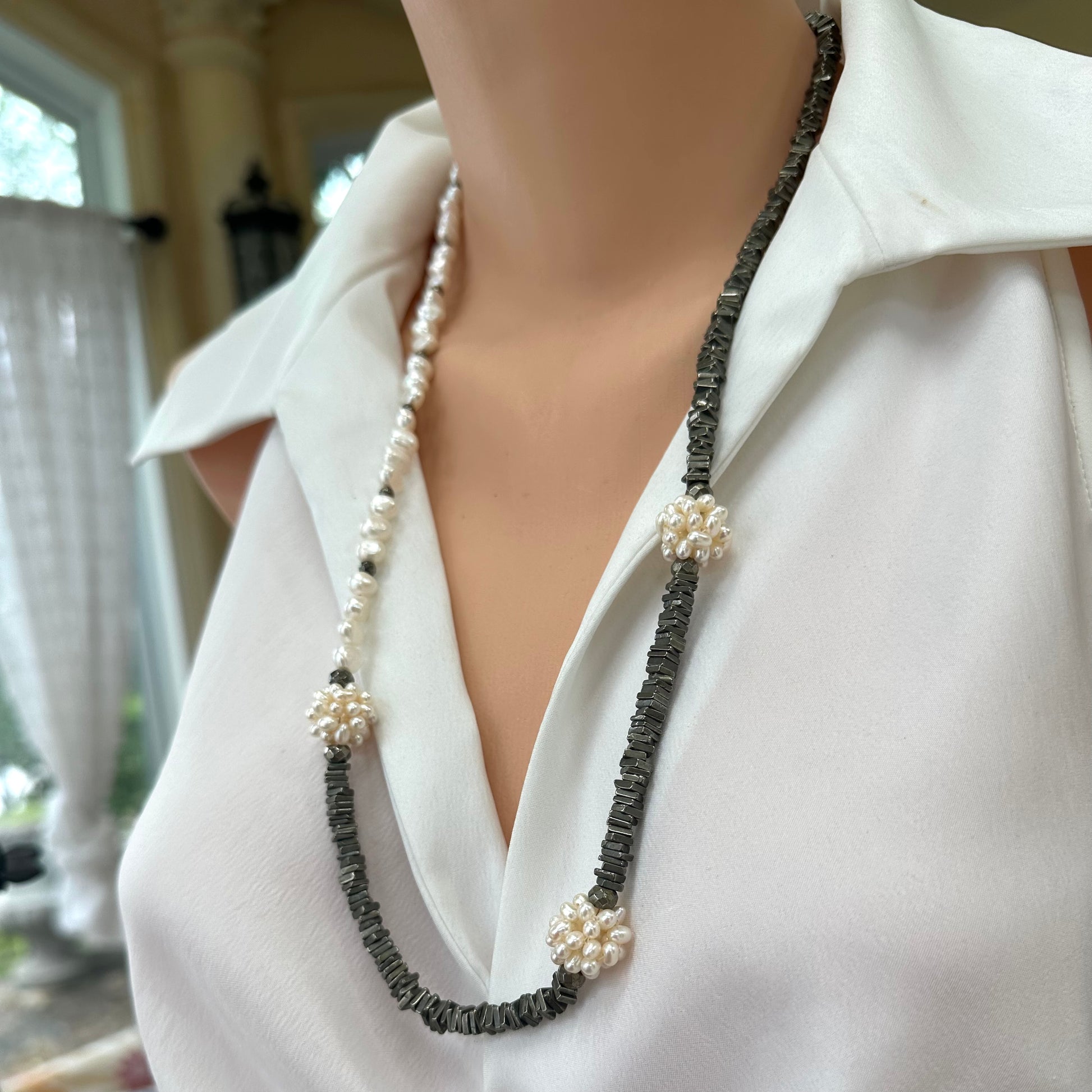 Pyrite and pearl necklace displayed on mannequin, side angle