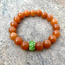 Charger l&#39;image dans la galerie, Orange Aventurine Stretch Bracelet with Green Rhinestones Pave Bead in Middle
