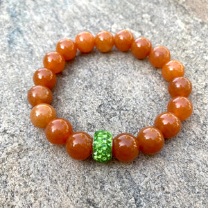 Orange Aventurine Stretch Bracelet with Green Rhinestones Pave Bead in Middle