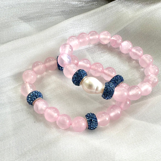 Pink jade bracelet featuring natural 10mm pink jade beads, a freshwater pearl, and rhinestone accents.