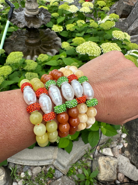 Aventurine jade pearl stretchy bracelet stacked on wrist showing mixed gemstone color combinations