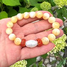 Load image into Gallery viewer, Honey Jade Stretch Bracelet with large pearl andOrange Rhinestones Pave Bead in Middle
