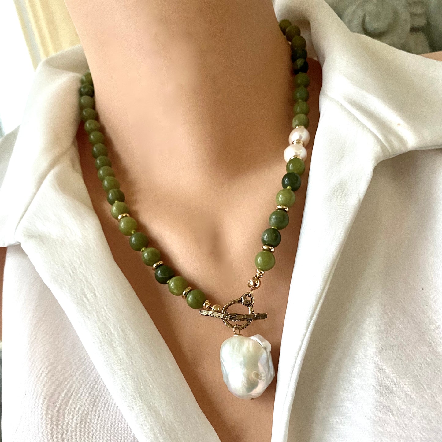 Olive green jade pearl necklace close up showing jade beads gold plated accents and baroque pearls