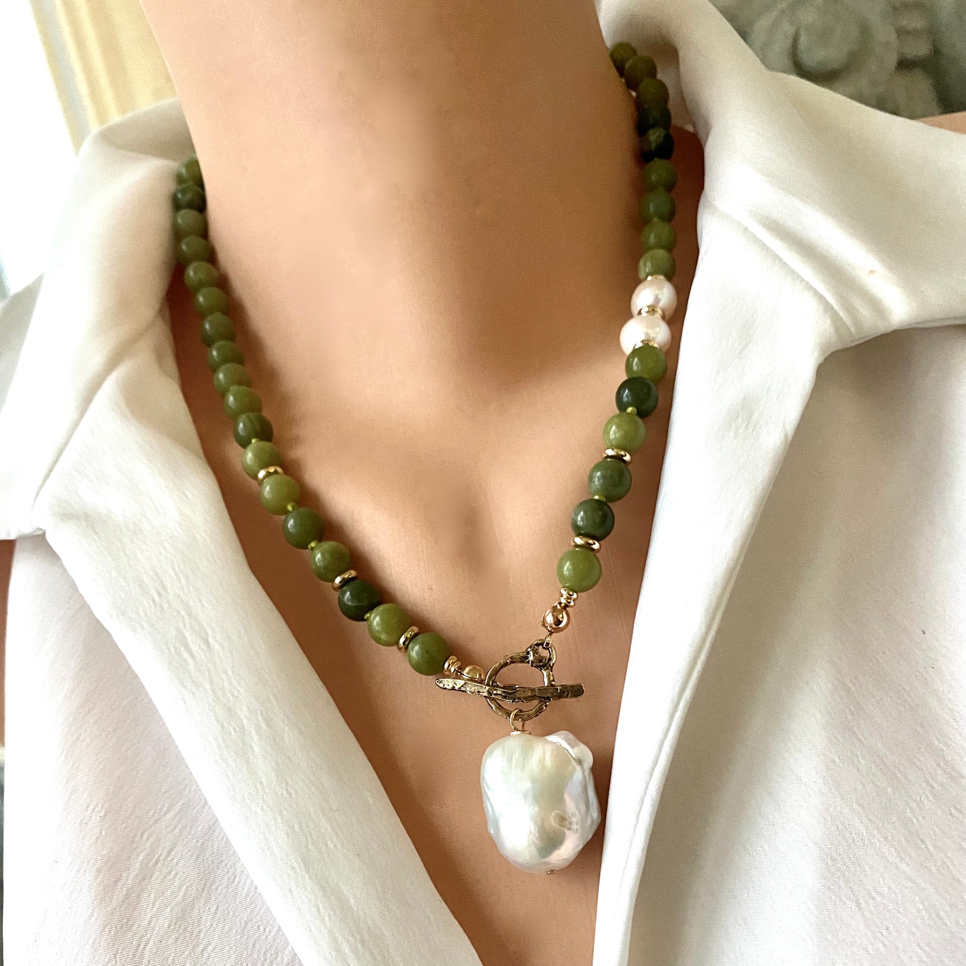 Olive green jade pearl necklace close up showing jade beads gold plated accents and baroque pearls