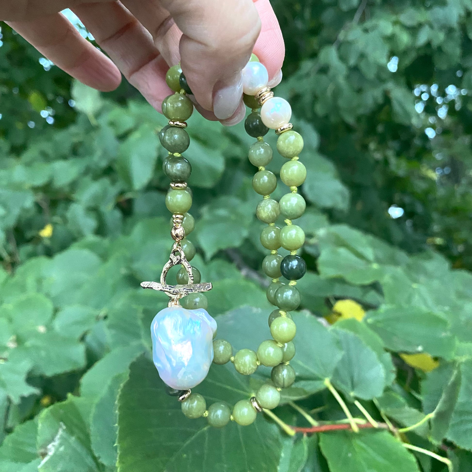 Olive green jade pearl necklace with artisan gold bronze details and baroque pearl pendant