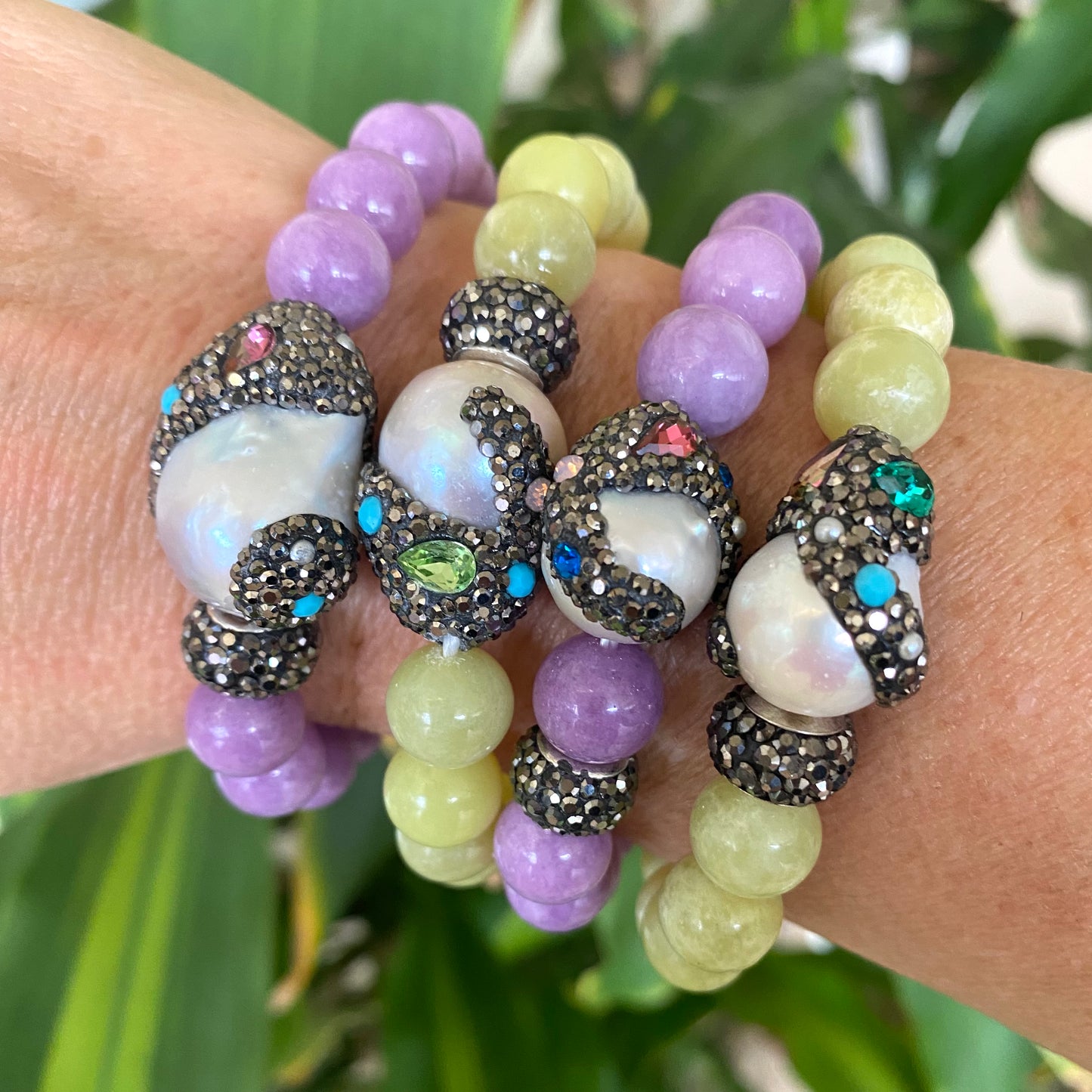Jade pearl bracelets stacked on wrist