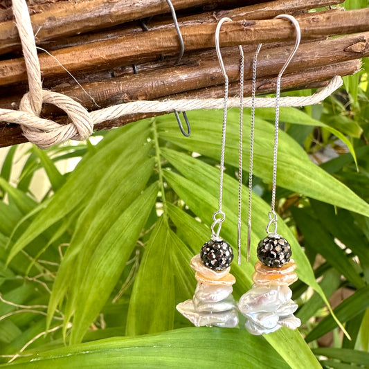 Gray and peach pearl threader earrings showcasing sterling silver petal design and natural freshwater pearls.