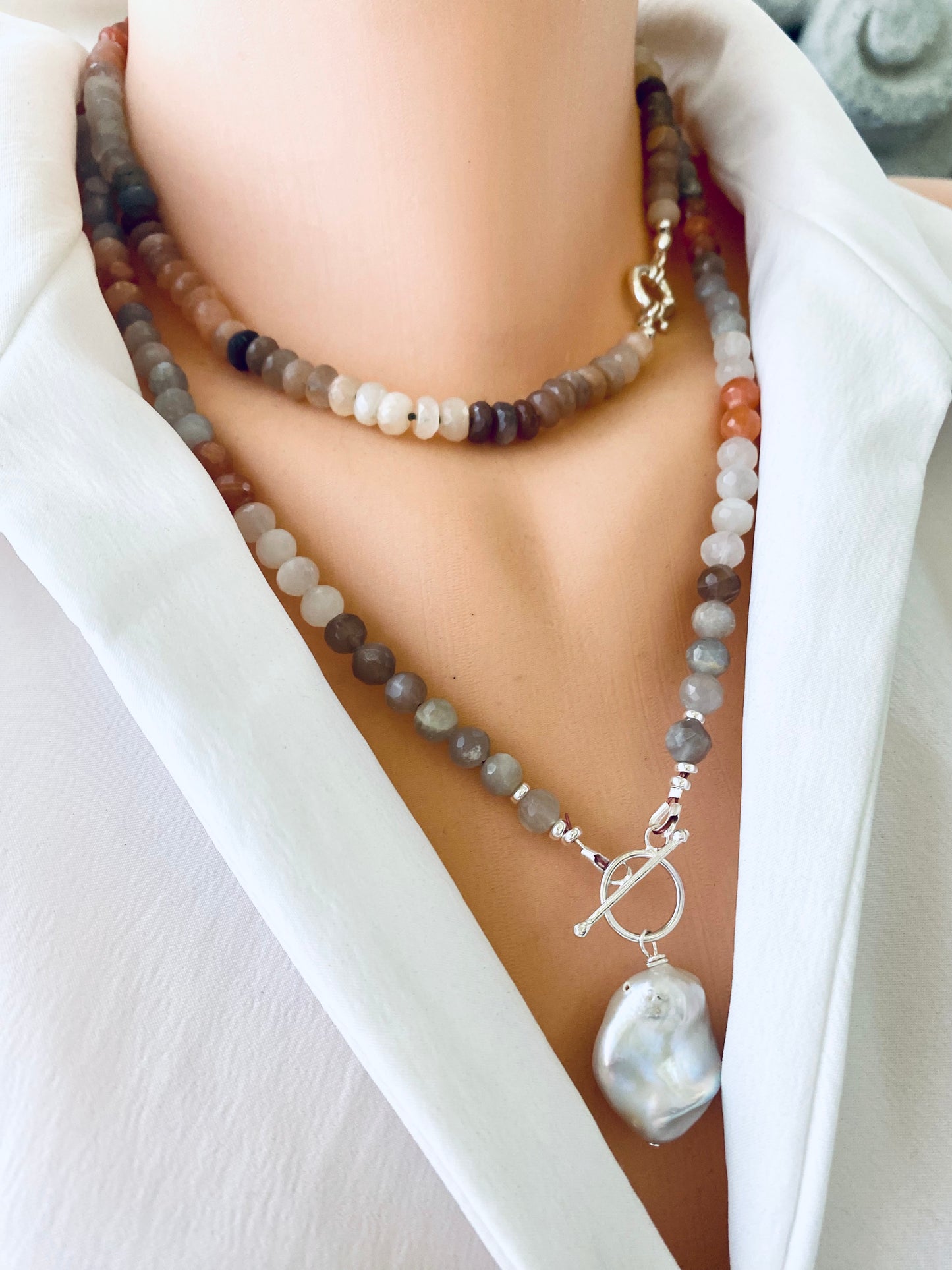 Moonstone candy necklace with sunstone beads showcased on a model's neck, highlighting gemstone elegance and craftsmanship.