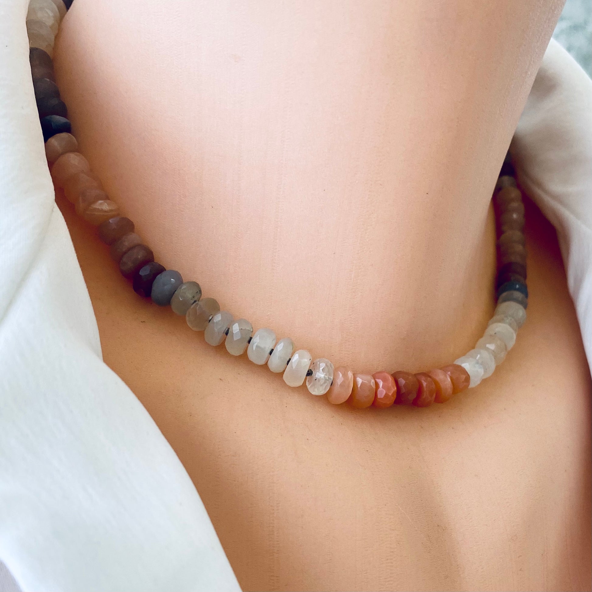 Moonstone candy necklace with sunstone beads featuring faceted gemstones for an elegant look.