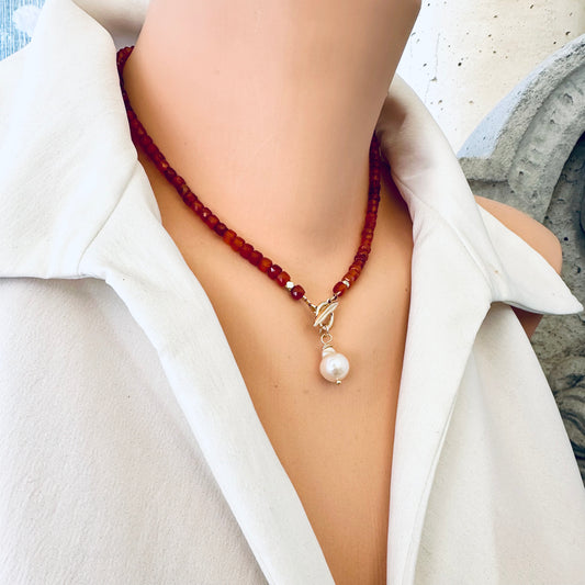 Carnelian toggle necklace with baroque pearl worn on model sitting at the collarbone