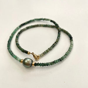 Stunning shaded  green Necklace featuring faceted Emerald roundelle beads and a greenish black Tahitian Pearl centerpiece. May birthstone Gift For Her. Crafted with gold filled, the necklace measures 18.5 inches in length