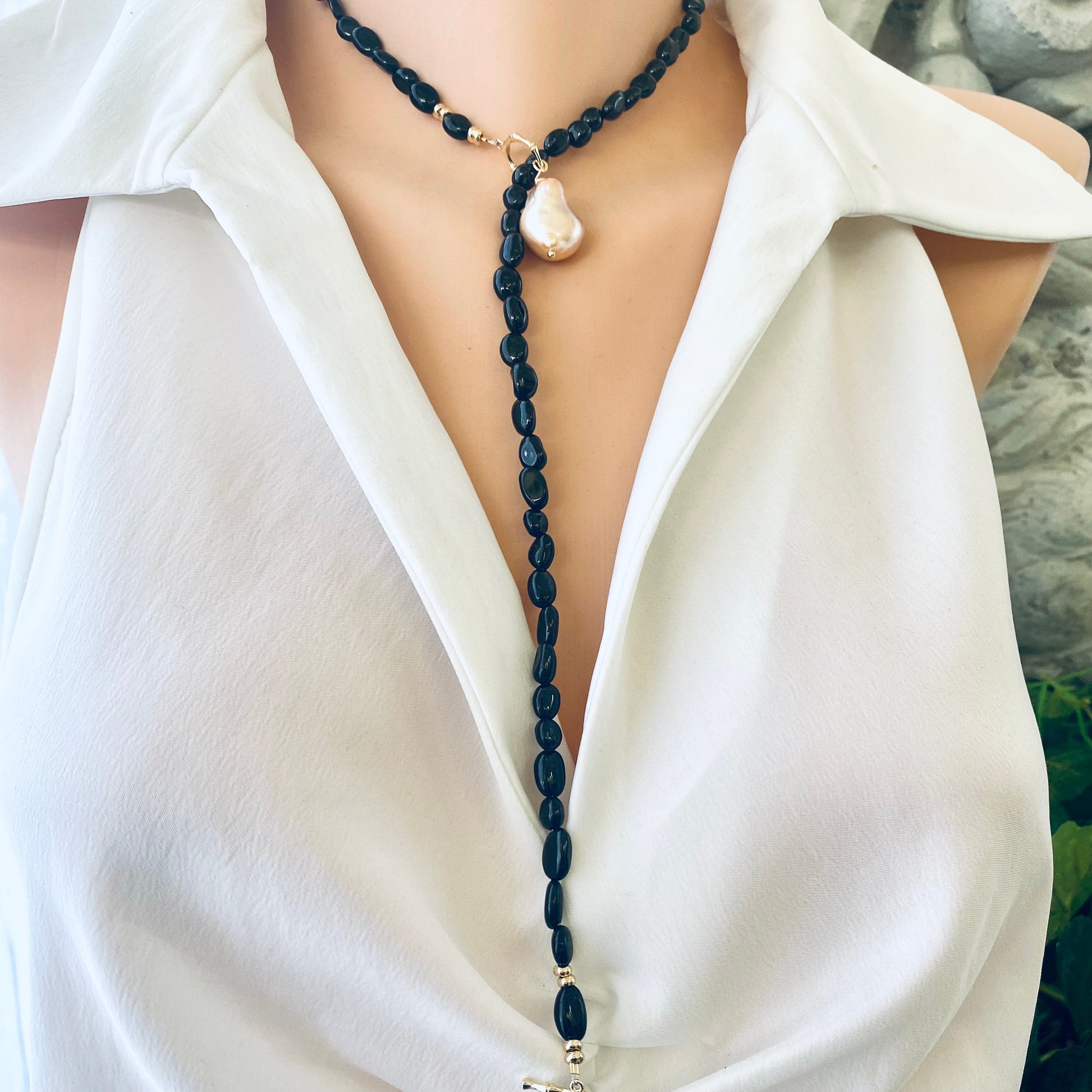 Black tourmaline pearl necklace worn on mannequin showing toggle clasp
