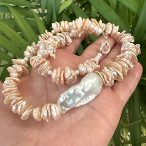 Freshwater Keshi Pearl Necklace in Peach Color, petal pearls drilled in the center, with White Large Baroque Pearl on the side. Secured with a Sterling Silver marine clasp and measures 18" Inches, approximately 46cm