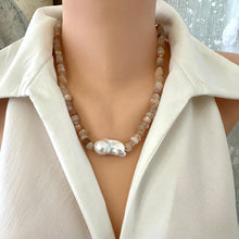 Load image into Gallery viewer, Hand-knotted necklace with mixed moonstone and a baroque pearl at the center, threaded with orange string, 20 inches long, featuring a sterling silver marine clasp.
