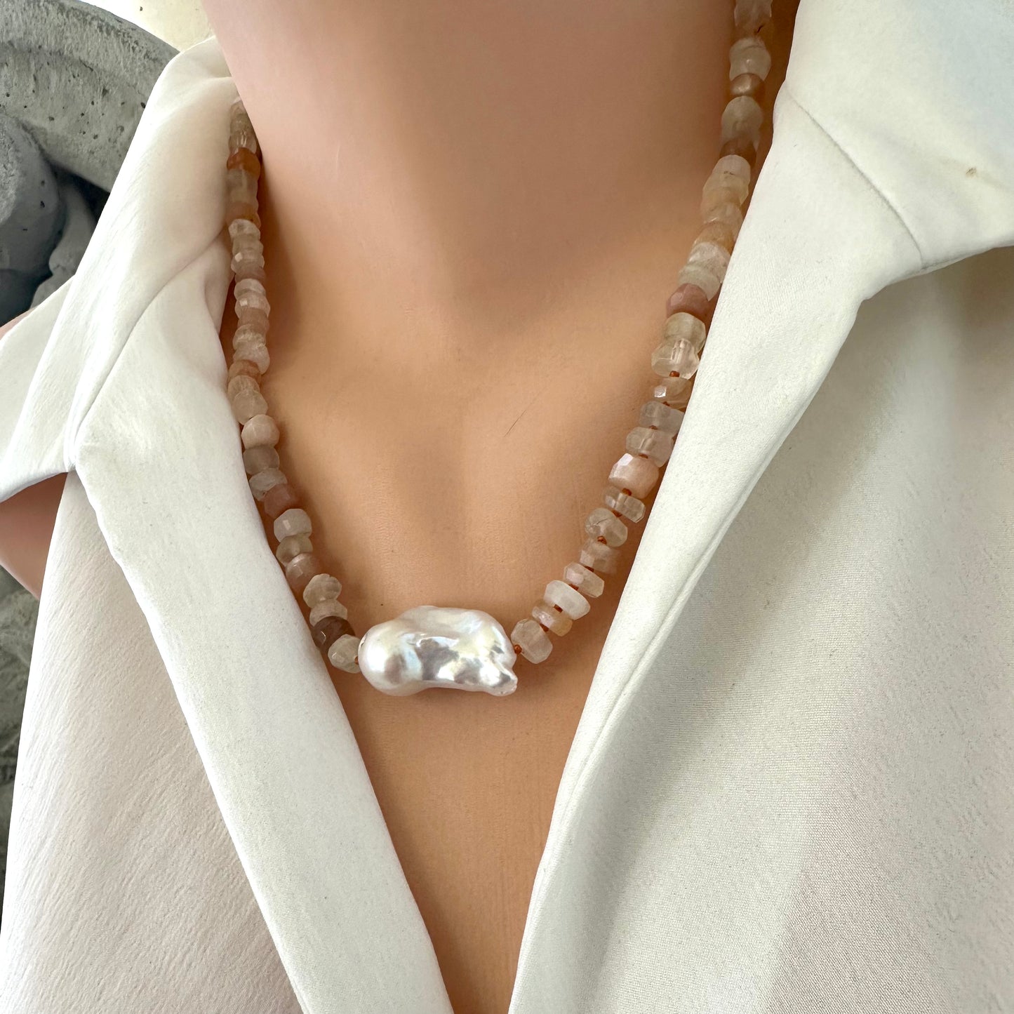 Front view of mixed moonstone and baroque pearl necklace displayed on mannequin bust