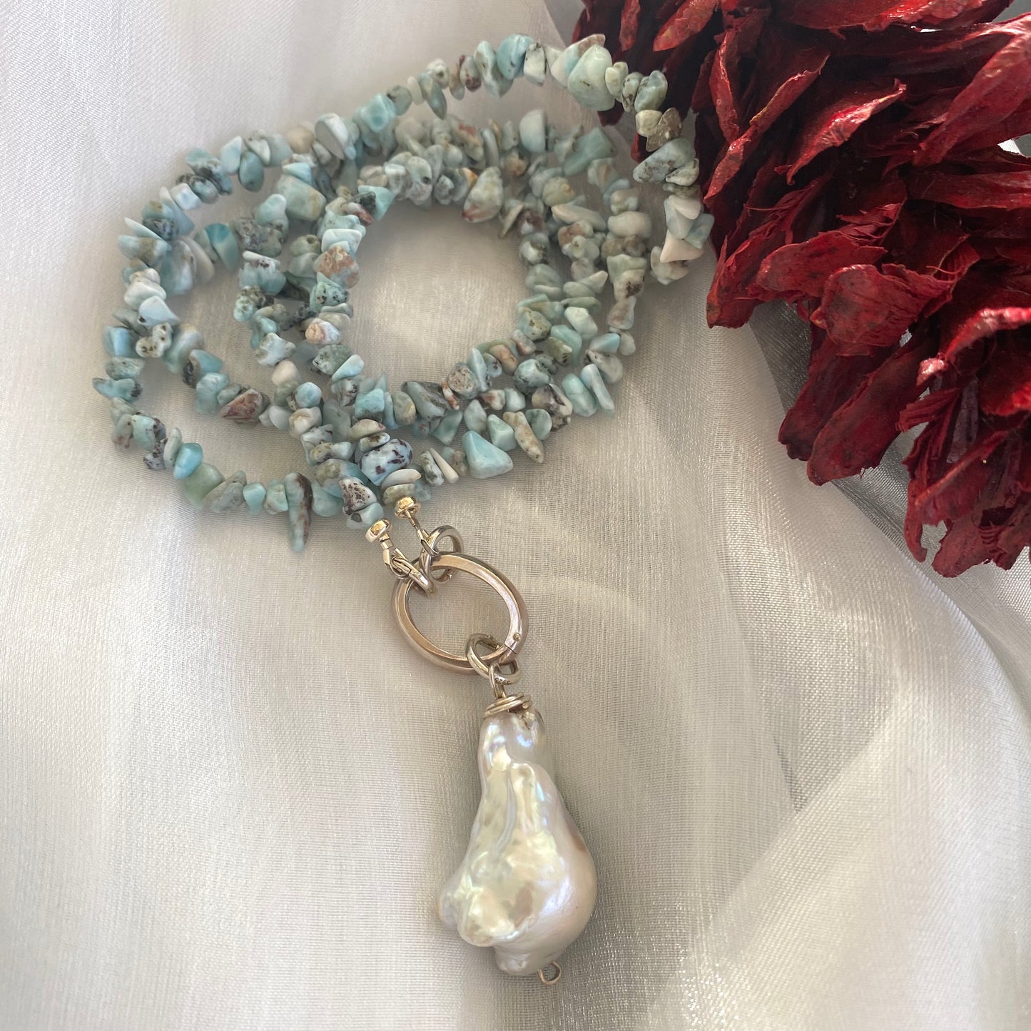 Larimar necklace with pearl pendant flat lay, larimar nugget beads with oversized baroque pearl drop