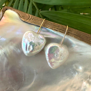 Heart-shaped freshwater pearl drop earrings, featuring 20mm pearls on gold vermeil-plated silver earring wires, perfect for bridal or romantic occasions.