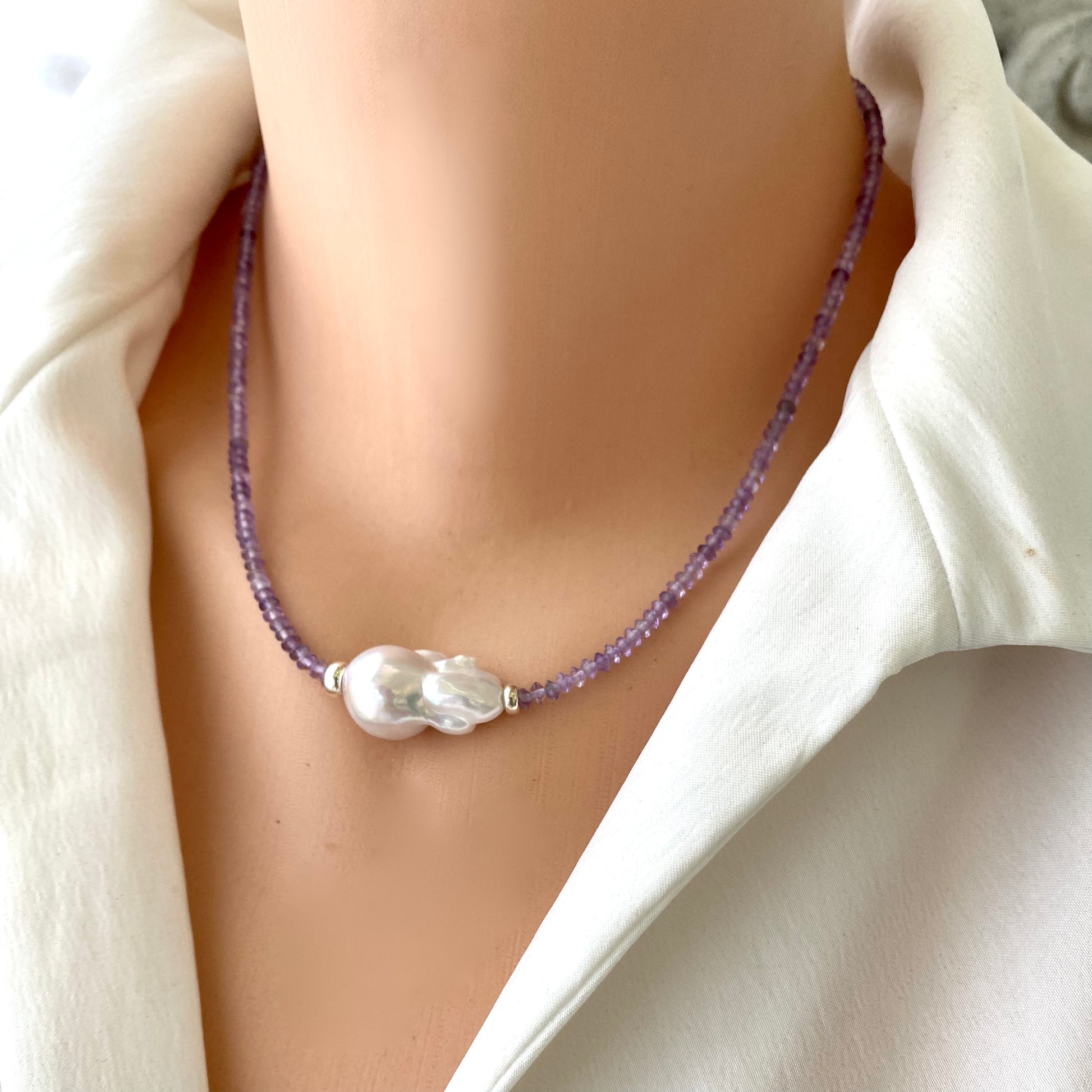 Lavender amethyst baroque pearl necklace showcasing pastel Amethyst beads and a luminous Baroque pearl. Elegant design.