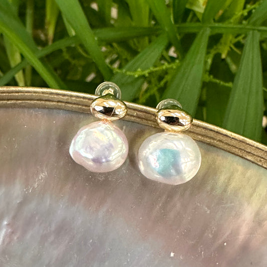Nugget pearl stud earrings in gold vermeil on white pearl shell background